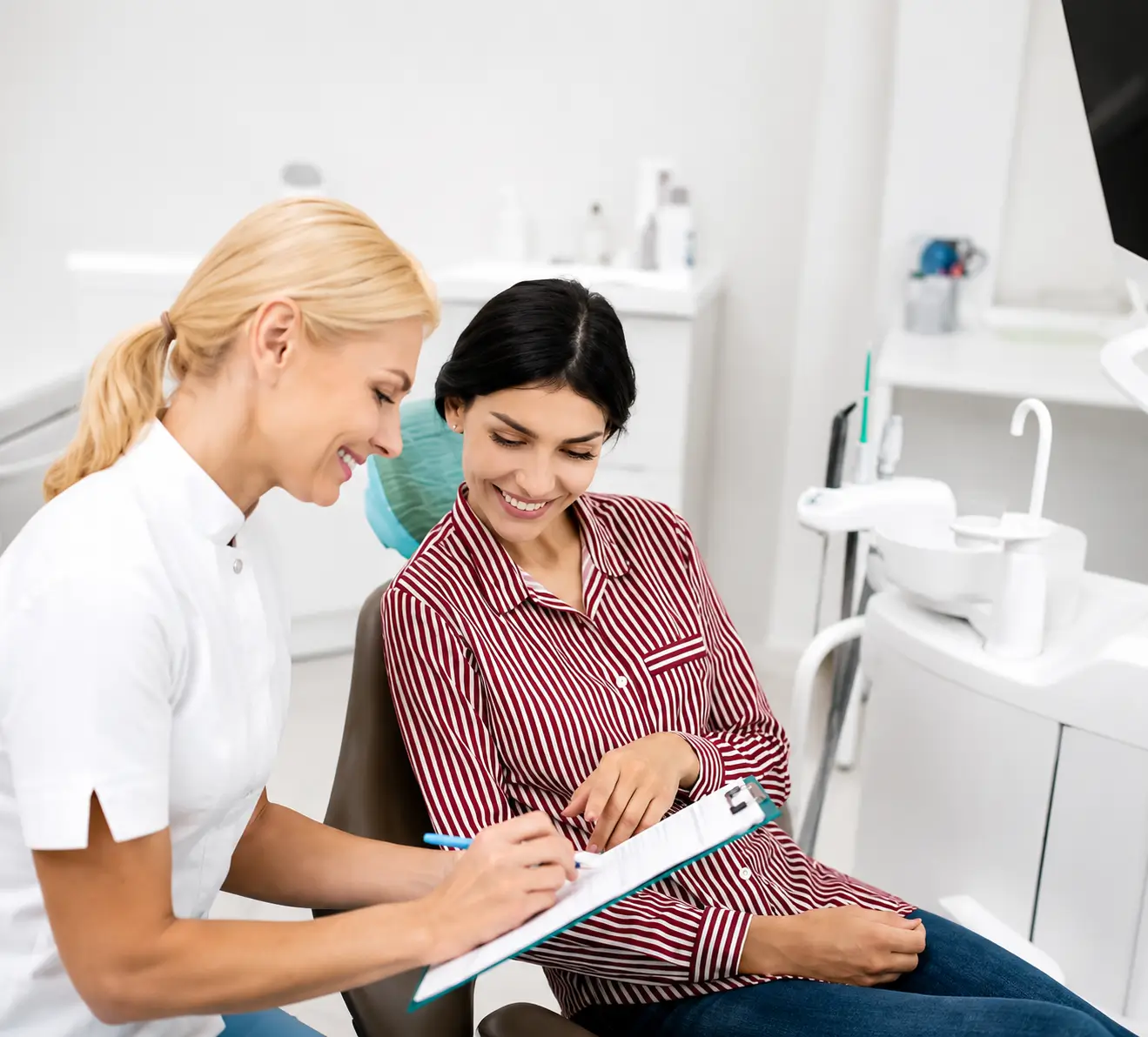 Clinician reviewing a form with a seated person