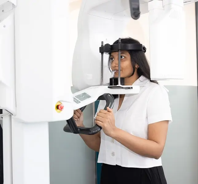 Patient undergoing a digital dental scan as part of a comprehensive gum disease assessment