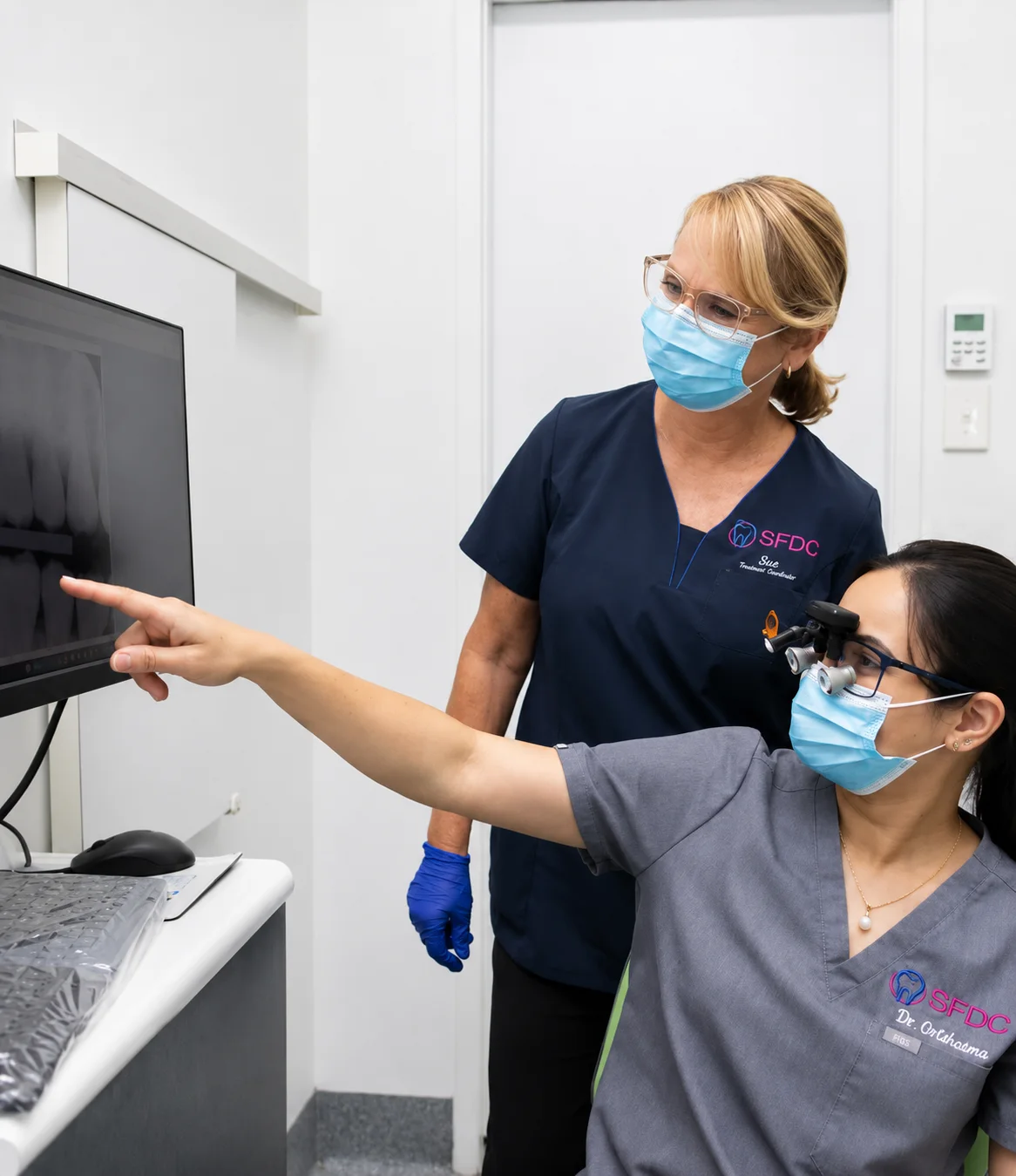 dr grishma chaudhari reviewing xrays with sue