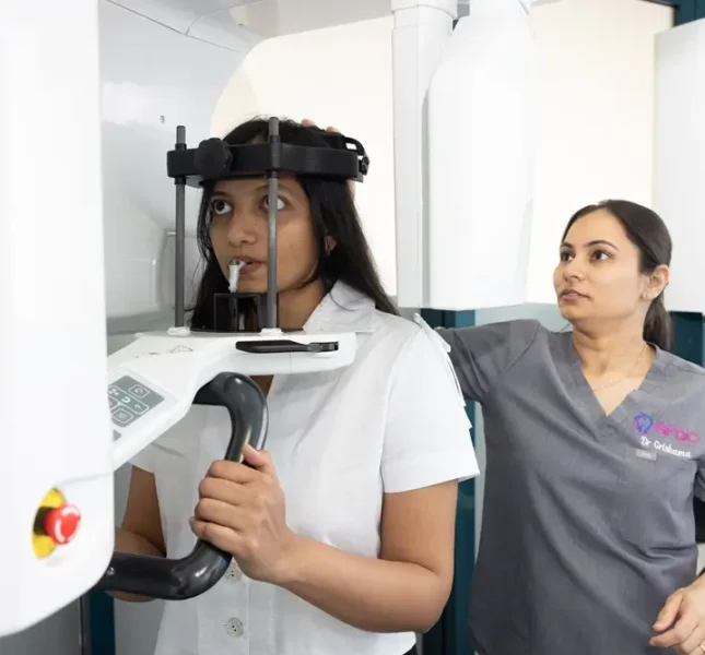 Dr Grishma assisting a patient during a dental CBCT scan