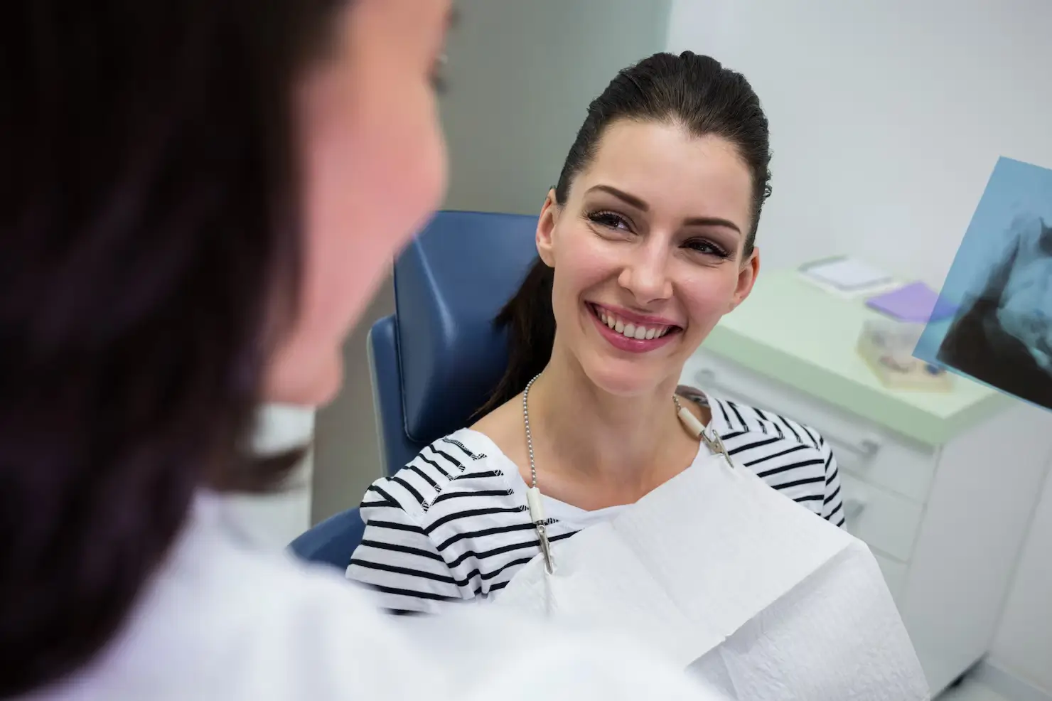 Patient discussing dental treatment options with a dentist during a consultation