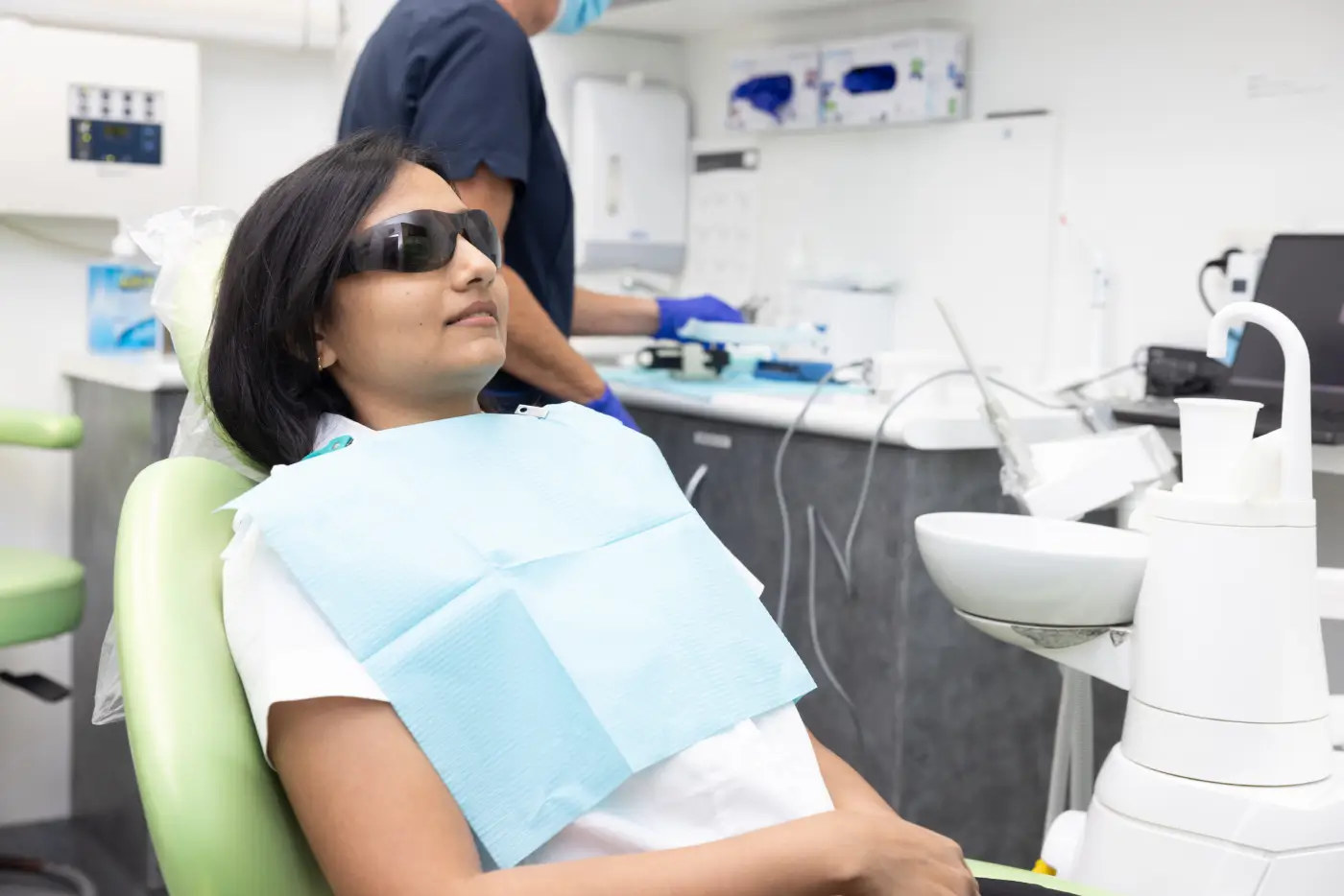 Patient wearing protective glasses in a dental chair at Southside Friendly Dental Care