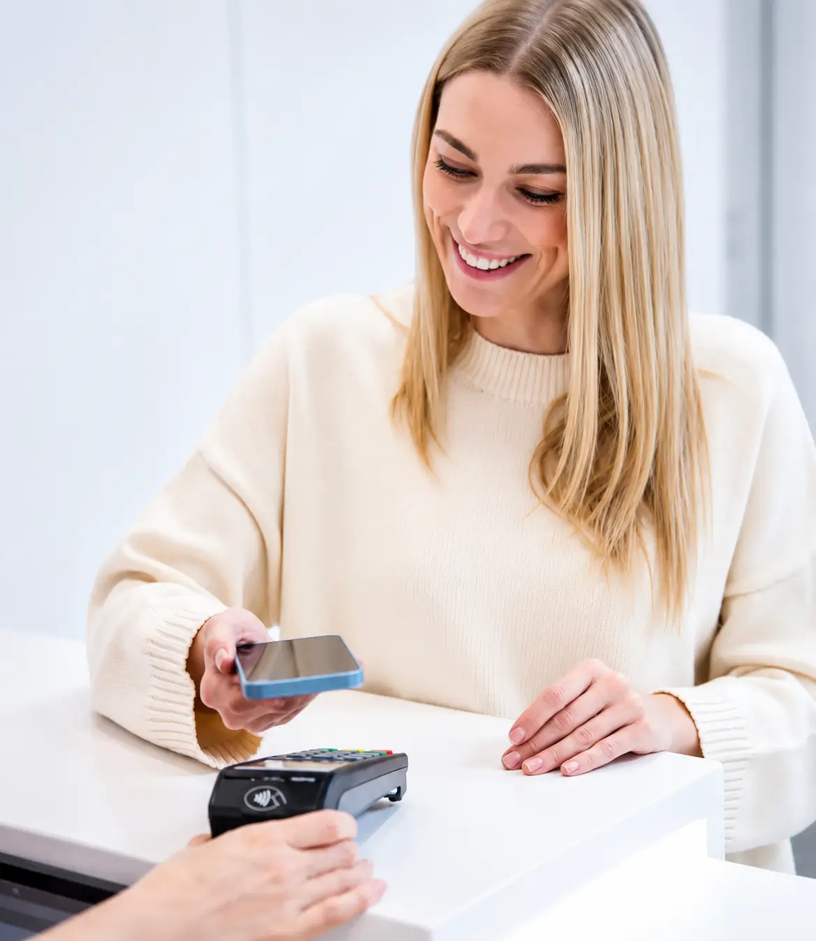 person making contactless payment smartphone