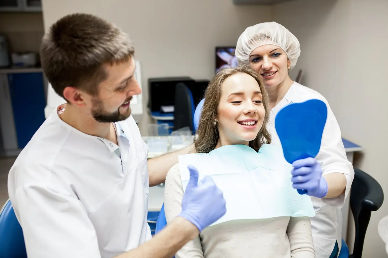 Dentist showing a patient her smile during a smile makeover consultation
