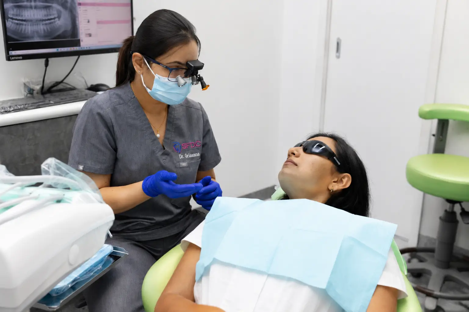 Dentist consulting with a patient before beginning a smile makeover treatment
