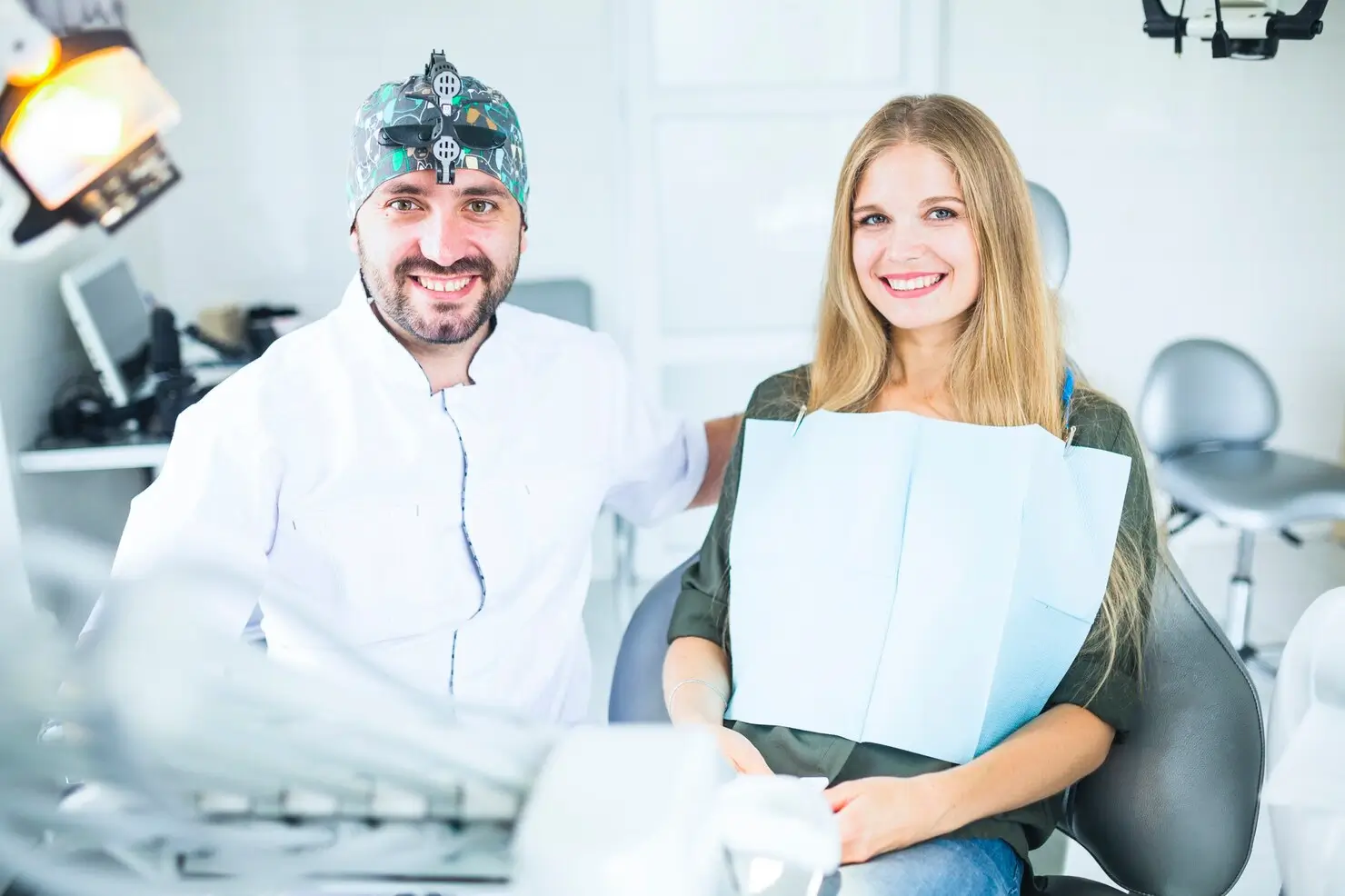 smiling dentist patient consultation