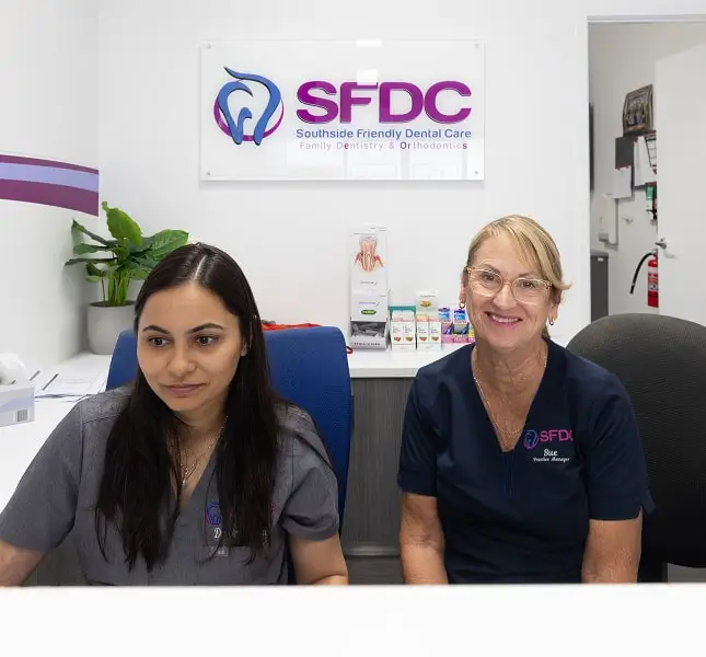 Southside Friendly Dental Care reception team seated at the front desk.