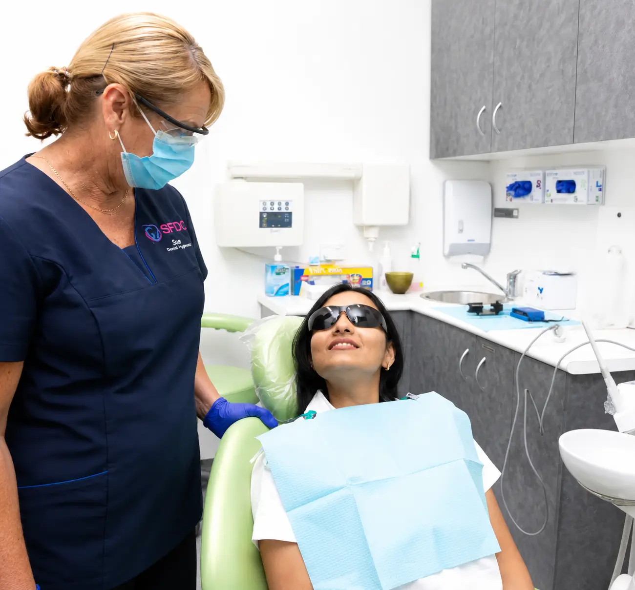 Southside Friendly Dental Care team member beside a patient in a dental chair