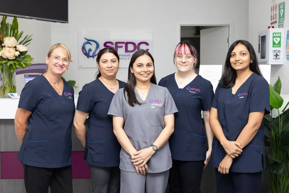 Southside Friendly Dental Care team members standing at the clinic reception