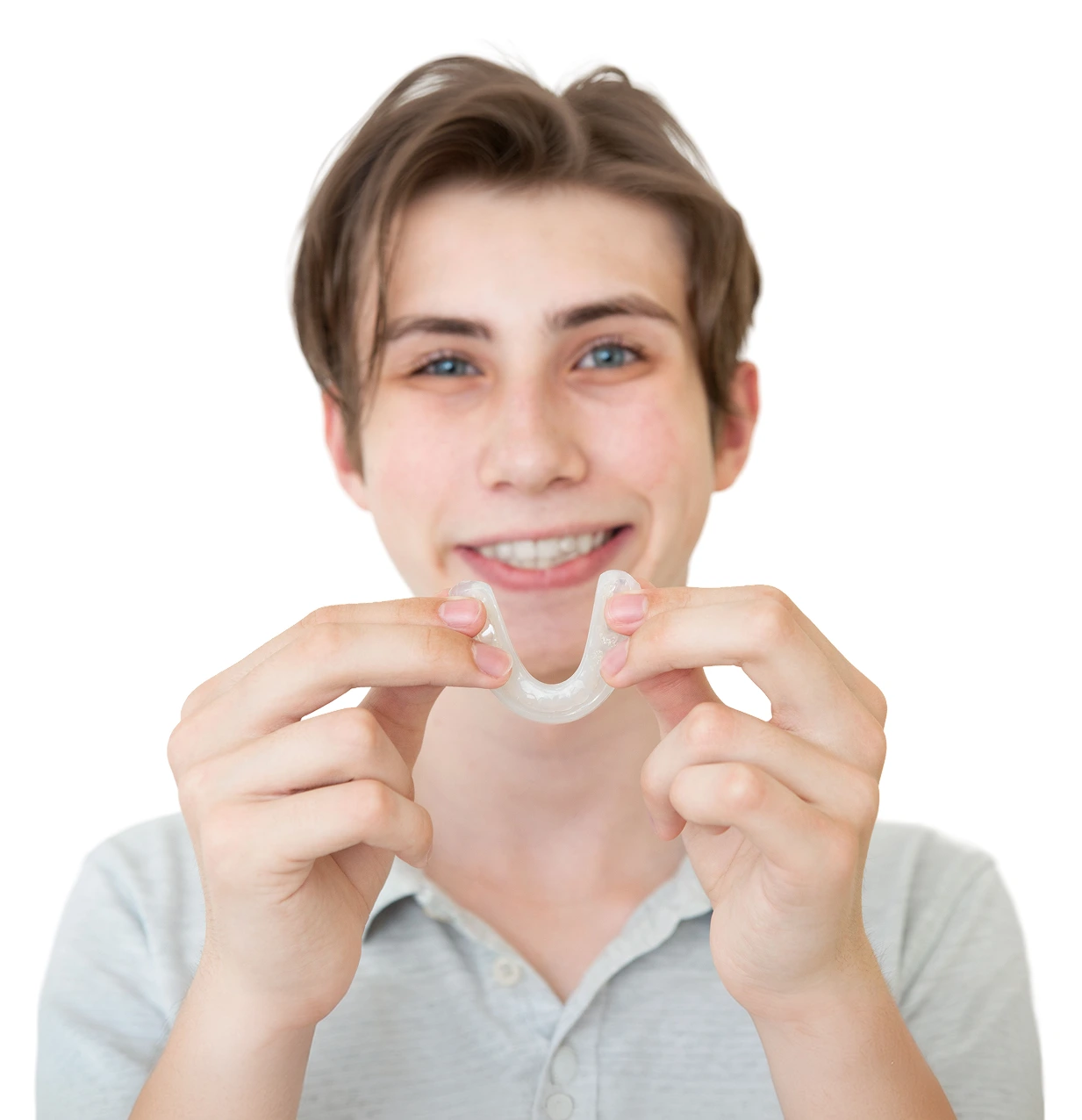 Young man holding a custom dental mouthguard