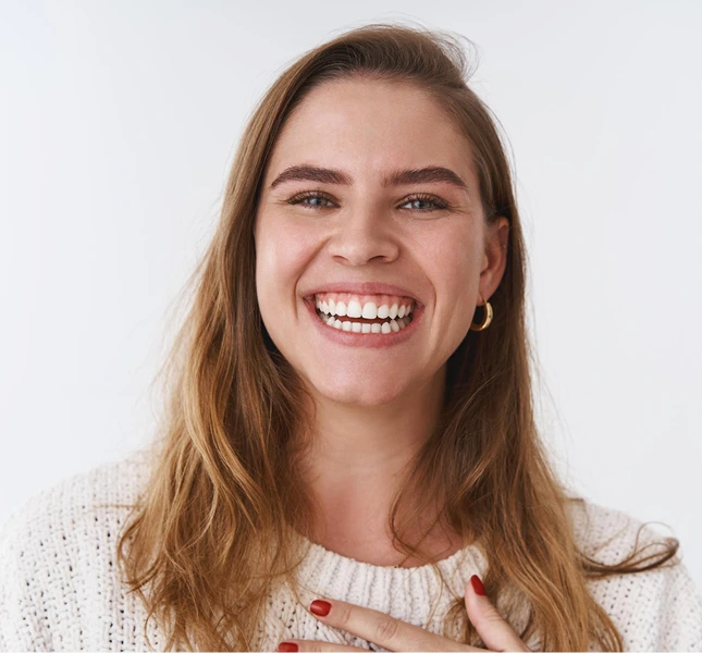 smiling woman white knitted top