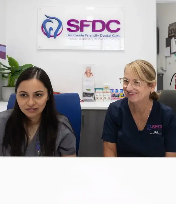 Dental team members assisting patients at Southside Friendly Dental Care reception