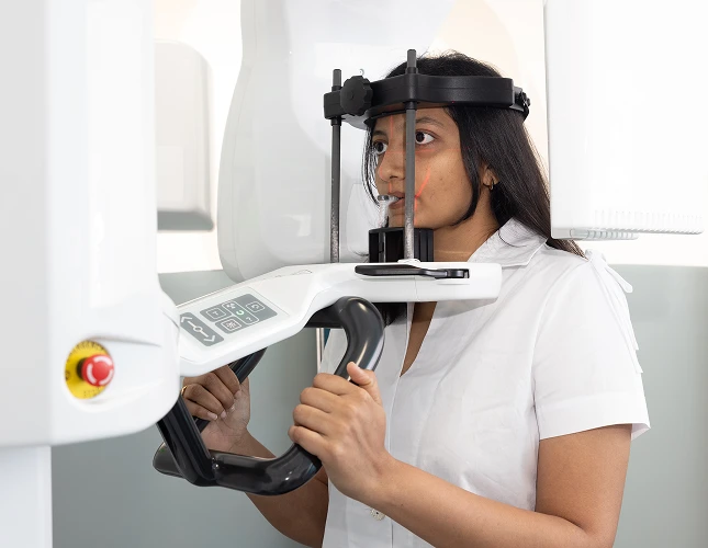 woman dental imaging machine
